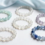 Air element crystal bracelets in aquamarine, clear quartz and blue lace agate on pale silk