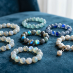 Water element crystal bracelets in rainbow moonstone, labradorite and pearl on teal velvet